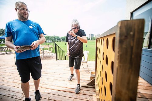 MIKAELA MACKENZIE / WINNIPEG FREE PRESS
	
Richard Kowalchuk, director of centralized services for DASCH (left), and Jenny Adams (who lives in a DASCH home) play yard games at the DASCH Inc. and DASCH Foundation 50th anniversary barbecue at the Norwood Community Centre on Tuesday, Aug. 20, 2024.

Winnipeg Free Press 2024