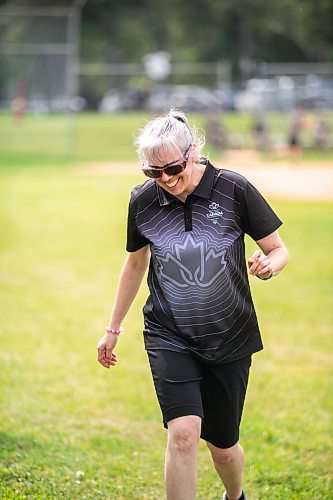 MIKAELA MACKENZIE / WINNIPEG FREE PRESS
	
Jenny Adams (who lives in a DASCH home) plays yard games at the DASCH Inc. and DASCH Foundation 50th anniversary barbecue at the Norwood Community Centre on Tuesday, Aug. 20, 2024.

Winnipeg Free Press 2024