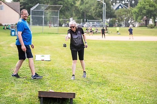 MIKAELA MACKENZIE / WINNIPEG FREE PRESS
	
Richard Kowalchuk, director of centralized services for DASCH (left), and Jenny Adams (who lives in a DASCH home) play yard games at the DASCH Inc. and DASCH Foundation 50th anniversary barbecue at the Norwood Community Centre on Tuesday, Aug. 20, 2024.

Winnipeg Free Press 2024