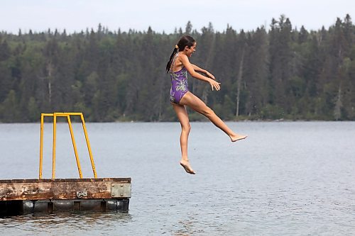 20082024
Scottlyn Moran of Portage la Prairie leaps off the dock into Clear Lake at Deep Bay in Riding Mountain National Park on an overcast and hot Tuesday afternoon.
(Tim Smith/The Brandon Sun)