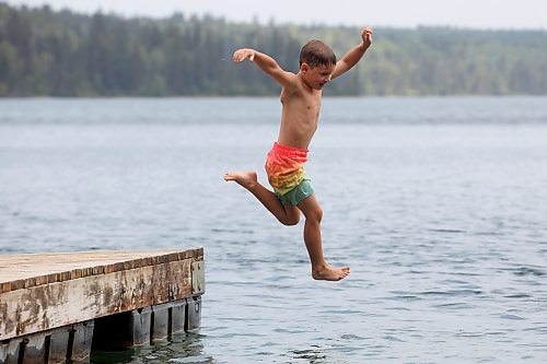 20082024
Bennett Davies of Brandon leaps off the dock into Clear Lake at Deep Bay in Riding Mountain National Park on an overcast and hot Tuesday afternoon.
(Tim Smith/The Brandon Sun)