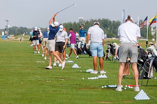 MIKE DEAL / FREE PRESS
Bryce Lewis (left, blue shirt) from Hendersonville, TN, takes a swing on the driving range with many other players Tuesday morning to get ready for the CentrePort Canada Rail Park Manitoba Open which will be starting on August 22 at Southwood Golf and Country Club.
See Mike McIntyre story
240820 - Tuesday, August 20, 2024.