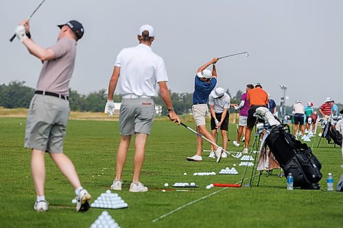 MIKE DEAL / FREE PRESS
Bryce Lewis (right, blue shirt) from Hendersonville, TN, takes a swing on the driving range with many other players Tuesday morning to get ready for the CentrePort Canada Rail Park Manitoba Open which will be starting on August 22 at Southwood Golf and Country Club.
See Mike McIntyre story
240820 - Tuesday, August 20, 2024.