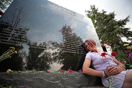 Ruth Bonneville /Free Press

Local - MADD Memorial photo
 
Photo of  Krista Brown holding a red flower next to the name of her partner, Martin Paul Robak, on the monument. Her partner&#x2019;s name was added on the weekend.

The MADD Manitoba Memorial Monument is located at Glen Eden Funeral Home and Cemetary 4477 Main Street West St. Paul.

Who: Krista Brown, partner of Martin Paul Robak who was killed by a drunk driver. 

Reporter: Jura

Aug 20, 2024