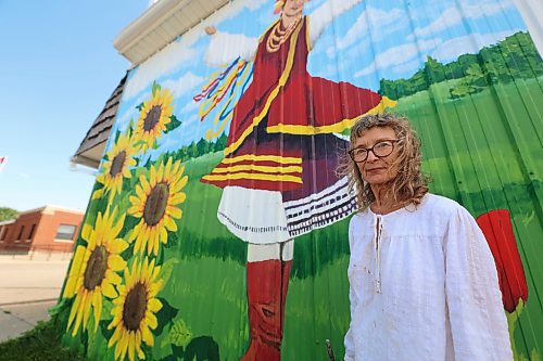 Mary Lowe stands in front of the Zion Pentecostal Church in Rivers. She and her daughter Mary are teaming up to cover the side of the building, which used to be a centre serving Ukrainian dance and language lessons. (Connor McDowell/Brandon Sun)