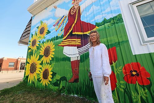 Mary Lowe stands in front of the Zion Pentecostal Church in Rivers. She and her daughter Mary are teaming up to cover the side of the building, which used to be a centre serving Ukrainian dance and language lessons. (Connor McDowell/Brandon Sun)