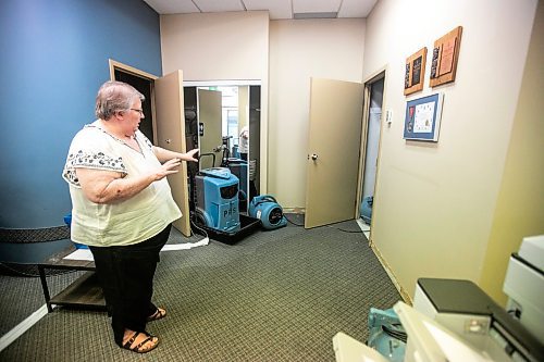 MIKAELA MACKENZIE / WINNIPEG FREE PRESS
	
Meals on Wheels executive director Marla Somersall in their office, which has industrial fans and dehumidifiers drying it out, after a flood damaged the Holiday Towers building in downtown Winnipeg on Wednesday, Aug. 21, 2024.

For Nicole story.
Winnipeg Free Press 2024