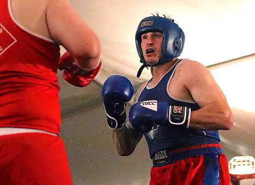 Former professional hockey player Josh Elmes prepares to throw a punch during an amateur boxing bout on June 15 at the Riverbank Discovery Centre. The Brandonite took up the sweet science after his pro hockey days ended. (Perry Bergson/The Brandon Sun)