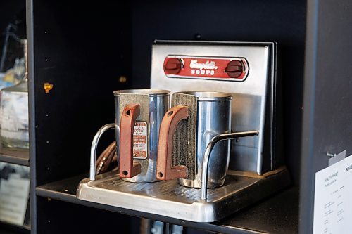 MIKE DEAL / FREE PRESS
Among the historical nicknacks that adorn the wall behind the coffee counter is a Vintage Campbell's Soup soup warmer.
Jeff Kendel is celebrating the 50th anniversary of Kendel's Diner and gas station at 1157 McLeod Avenue which he and his father opened in 1974 when they bought the one bay service station that happened to include a small restaurant.
See Matt Frank story
240821 - Wednesday, August 21, 2024.