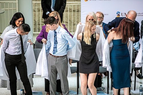 MIKAELA MACKENZIE / WINNIPEG FREE PRESS
	
The newest University of Manitoba medical class don their first white coats in a ceremony at the Max Rady College of Medicine on Wednesday, Aug. 21, 2024.

For Jura story.
Winnipeg Free Press 2024