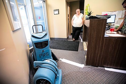 MIKAELA MACKENZIE / WINNIPEG FREE PRESS
	
Meals on Wheels executive director Marla Somersall in their office, which has industrial fans and dehumidifiers drying it out, after a flood damaged the Holiday Towers building in downtown Winnipeg on Wednesday, Aug. 21, 2024.

For Nicole story.
Winnipeg Free Press 2024