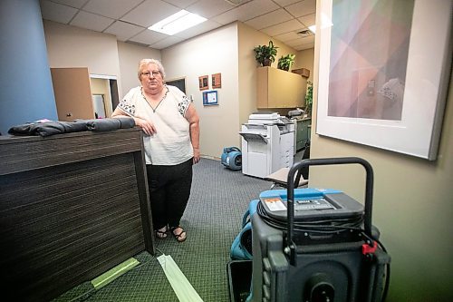 MIKAELA MACKENZIE / WINNIPEG FREE PRESS
	
Meals on Wheels executive director Marla Somersall in their office, which has industrial fans and dehumidifiers drying it out, after a flood damaged the Holiday Towers building in downtown Winnipeg on Wednesday, Aug. 21, 2024.

For Nicole story.
Winnipeg Free Press 2024