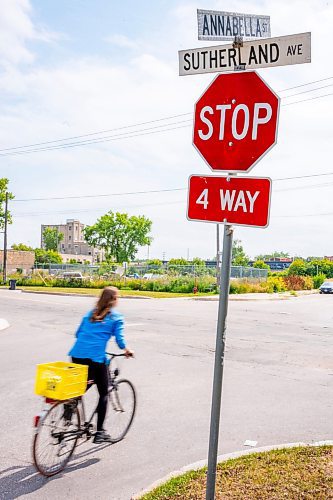 NIC ADAM / FREE PRESS
Hillary Rosentreter, pictured at the corner of Annabella St. and Sutherland Ave. Wednesday, is calling for the province to change the Highway Traffic Act to allow those on bikes to do an &#x201c;Idaho stop,&#x201d; basically treating stop signs as yields where they can proceed through as safe without coming to a full stop. 
240821 - Wednesday, August 21, 2024.

Reporter: Joyanne