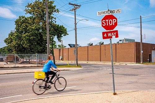 NIC ADAM / FREE PRESS
Hillary Rosentreter, pictured at the corner of Annabella St. and Sutherland Ave. Wednesday, is calling for the province to change the Highway Traffic Act to allow those on bikes to do an &#x201c;Idaho stop,&#x201d; basically treating stop signs as yields where they can proceed through as safe without coming to a full stop. 
240821 - Wednesday, August 21, 2024.

Reporter: Joyanne