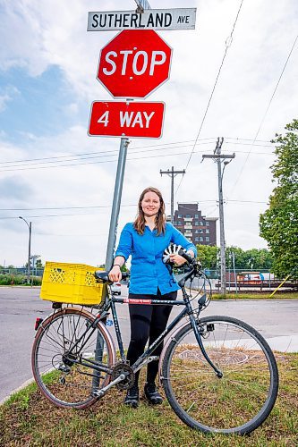 NIC ADAM / FREE PRESS
Hillary Rosentreter, pictured at the corner of Annabella St. and Sutherland Ave. Wednesday, is calling for the province to change the Highway Traffic Act to allow those on bikes to do an &#x201c;Idaho stop,&#x201d; basically treating stop signs as yields where they can proceed through as safe without coming to a full stop. 
240821 - Wednesday, August 21, 2024.

Reporter: Joyanne