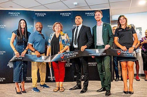 NIC ADAM / FREE PRESS
Deputy Mayor Janice Lukes (centre left) cuts the ribbon for the opening of The Bridgewater, Wednesday.
240821 - Wednesday, August 21, 2024.

Reporter: Gabby Piche