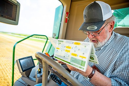 NIC ADAM / FREE PRESS
Farmer Larry Goossen, 80, sets in his John Deere combine at the growing project&#x2019;s field outside Landmark, MB., Tuesday. He&#x2019;s been driving a combine since he was 14 and likes to volunteer for the project every year.
240820 - Tuesday, August 20, 2024.

Reporter: