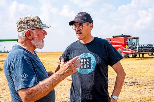 NIC ADAM / FREE PRESS
Foodgrains regional representative Gordon Janzen (right) at the growing project&#x2019;s field outside Landmark, MB., Tuesday.
240820 - Tuesday, August 20, 2024.

Reporter: