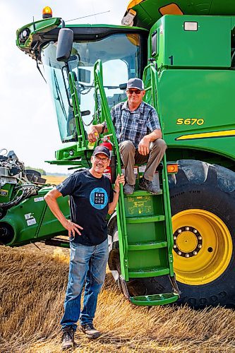 NIC ADAM / FREE PRESS
Foodgrains regional representative Gordon Janzen (below) and Landmark growing project coordinator Randy Plett pictured next to a combine at the growing project&#x2019;s field outside Landmark, MB., Tuesday.
240820 - Tuesday, August 20, 2024.

Reporter: