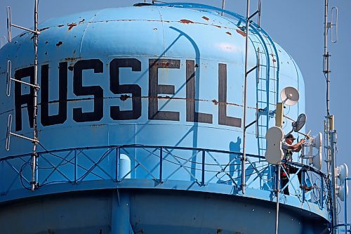 21082024
A man works atop the water tower in Russell, Manitoba on a hot and sunny Wednesday. 
(Tim Smith/The Brandon Sun)