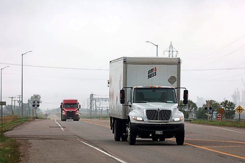 Trucks made their way along Richmond Ave. East of Brandon on Thursday (Abiola Odutola/The Brandon Sun