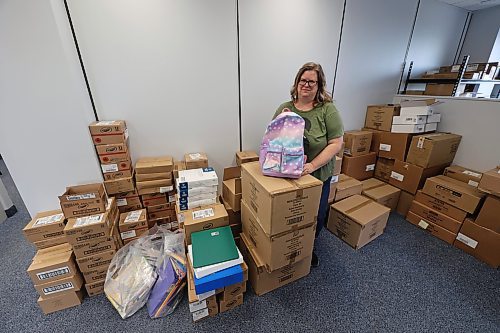 Cynamon Mychasiw of United Way Brandon shows some of the supplies for kids that will be shared by the end of August. (Abiola Odutola/The Brandon Sun)