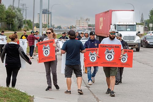 MIKE DEAL / FREE PRESS
Members of the Teamsters Canada Rail Conference union on the picket line at the CP Winnipeg Yard, Keewatin Street entrance, Thursday morning.
Train conductors and engineers took to picket lines Thursday across Winnipeg on the first day of the largest railway lockout in Canadian history.
CN and CPKC shut down Canada&#x2019;s freight rail network after contract negotiations with the Teamsters Union broke down.
See Matt Frank / Martin Cash story
240822 - Thursday, August 22, 2024.