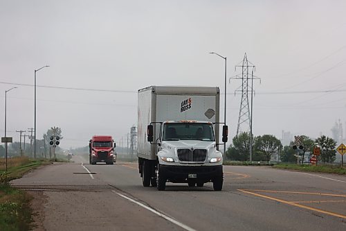 Trucks made their way along Richmond Ave. East of Brandon on Thursday (Abiola Odutola/The Brandon Sun