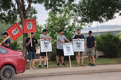 Some Teamsters Rail members picket at the CPKC Brandon office located at 355 Pacific Ave. on Thursday morning. About 15 union members picket at the general yard office with 'Lock out' plaqad. (Abiola Odutola/The Brandon Sun)