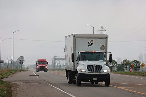 Trucks made their way along Richmond Ave. East of Brandon on Thursday (Abiola Odutola/The Brandon Sun