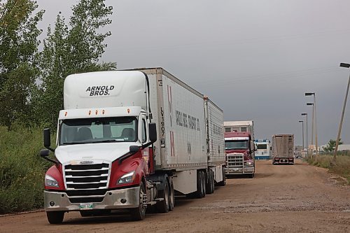 Trucks make their way out of Maple Leaf Foods Brandon located at 6355 Richmond Ave East on Thursday. (Abiola Odutola/The Brandon Sun)