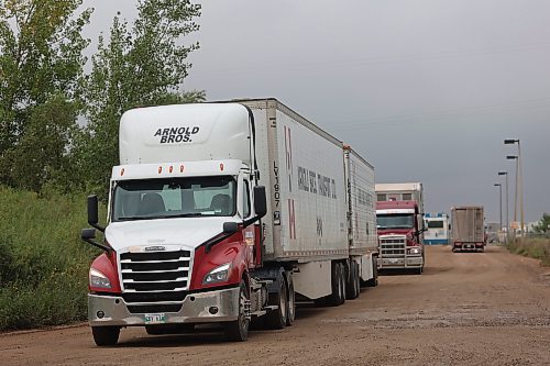 Trucks make their way out of Maple Leaf Foods Brandon located at 6355 Richmond Ave East on Thursday. (Abiola Odutola/The Brandon Sun)