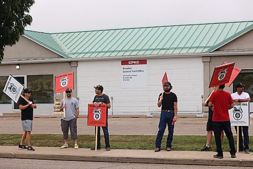 Some Teamsters Rail members picket at the CPKC Brandon office located at 355 Pacific Ave. on Thursday morning. About 15 union members picket at the general yard office with 'Lock out' plaqad. (Abiola Odutola/The Brandon Sun)