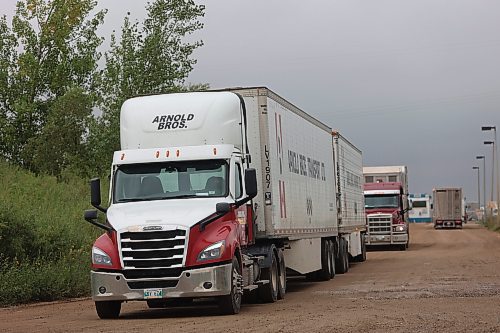 Trucks make their way out of Maple Leaf Foods Brandon located at 6355 Richmond Ave East on Thursday. (Abiola Odutola/The Brandon Sun)