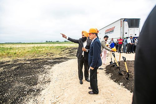 MIKAELA MACKENZIE / WINNIPEG FREE PRESS
	
Highway Motor Freight president and CEO Jass Dhillon points out where they will build to MP Kevin Lamoureux after turning sod as Highway Motor Freight is announced as CentrePort Canada Rail Park&#x573; newest tenant on Thursday, Aug. 22, 2024.

For Martin Cash story.
Winnipeg Free Press 2024