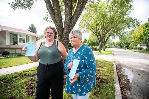 MIKAELA MACKENZIE / WINNIPEG FREE PRESS
	
Paige Johal (left) and Joyce Maryk, who were forced to remove tree decorations and a garden box on the boulevard after recieving notices from the city, in their Transcona neighbourhood on Thursday, Aug. 22, 2024.

For Nicole story.
Winnipeg Free Press 2024