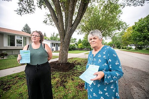 MIKAELA MACKENZIE / WINNIPEG FREE PRESS
	
Paige Johal (left) and Joyce Maryk, who were forced to remove tree decorations and a garden box on the boulevard after recieving notices from the city, in their Transcona neighbourhood on Thursday, Aug. 22, 2024.

For Nicole story.
Winnipeg Free Press 2024