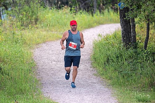 BROOK JONES / FREE PRESS
Jonathan Courchene, who is a First Nations triathlete, competes in the run portion of the Free Spirit Sprint Triathlon in Pinawa, Man., Sunday, Aug. 11, 2024.