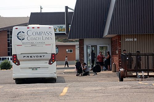 Evacuees are seen outside the Victoria Inn on Friday. (Connor McDowel/Brandon Sun) 