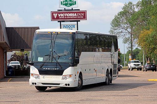 A bus is seen outside the Victoria Inn on Friday. Evacuees from wildfires in northern Manitoba are being housed in several hotels in the city and transported by bus. (Connor McDowell/Brandon Sun)