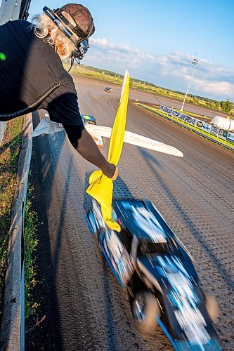 NIC ADAM / FREE PRESS
Race director Carl Mulder waves flags at Thursday night thunder at Victory Lanes Speedway. 
240822 - Thursday, August 22, 2024.

Reporter: ?