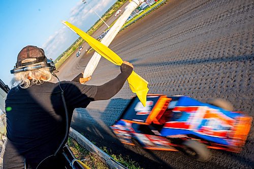 NIC ADAM / FREE PRESS
Race director Carl Mulder waves flags at Thursday night thunder at Victory Lanes Speedway. 
240822 - Thursday, August 22, 2024.

Reporter: ?