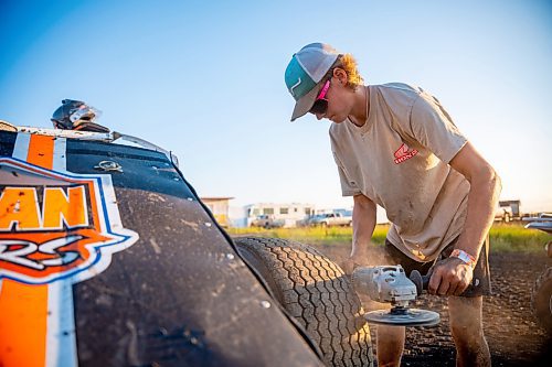 NIC ADAM / FREE PRESS
Ryder Woodward shaves his teams&#x2019; tires at Thursday night thunder at Victory Lanes Speedway. This helps rejuvenate the rubber and gives the driver more grip on the track.
240822 - Thursday, August 22, 2024.

Reporter: ?