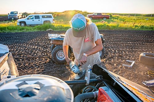 NIC ADAM / FREE PRESS
Ryder Woodward shaves his teams&#x2019; tires at Thursday night thunder at Victory Lanes Speedway. This helps rejuvenate the rubber and gives the driver more grip on the track.
240822 - Thursday, August 22, 2024.

Reporter: ?