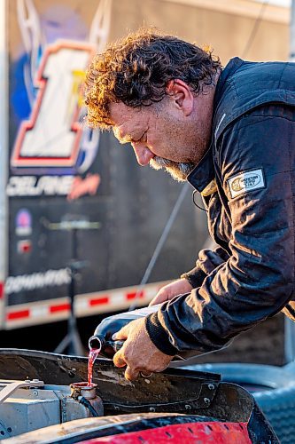 NIC ADAM / FREE PRESS
Stefan Klym works on his car at Thursday night thunder at Victory Lanes Speedway. This helps rejuvenate the rubber and gives the driver more grip on the track.
240822 - Thursday, August 22, 2024.

Reporter: ?