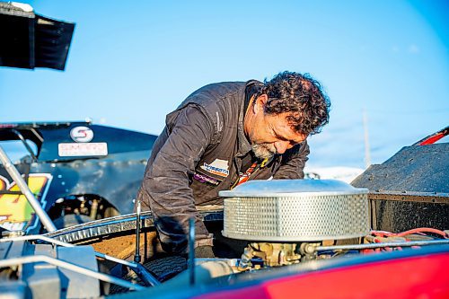 NIC ADAM / FREE PRESS
Stefan Klym works on his car at Thursday night thunder at Victory Lanes Speedway. This helps rejuvenate the rubber and gives the driver more grip on the track.
240822 - Thursday, August 22, 2024.

Reporter: ?