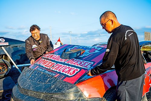 NIC ADAM / FREE PRESS
Stefan Klym works on his car at Thursday night thunder at Victory Lanes Speedway. This helps rejuvenate the rubber and gives the driver more grip on the track.
240822 - Thursday, August 22, 2024.

Reporter: ?