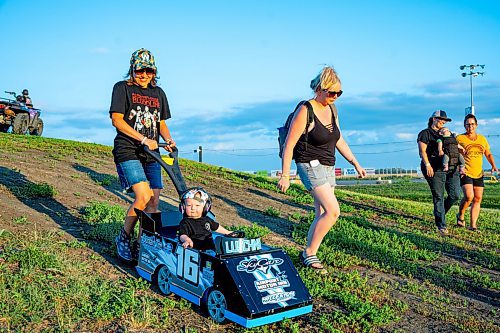 NIC ADAM / FREE PRESS
Nikita Jarrow (left) pushes Parker Luschinski to the pit area at Thursday night thunder at Victory Lanes Speedway. 
240822 - Thursday, August 22, 2024.

Reporter: ?