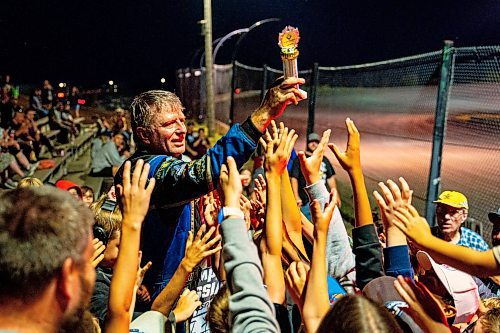 NIC ADAM / FREE PRESS
Midwest modified winner Rick Delaine gives his trophy to a young spectator at Thursday night thunder at Victory Lanes Speedway. 
240822 - Thursday, August 22, 2024.

Reporter: ?