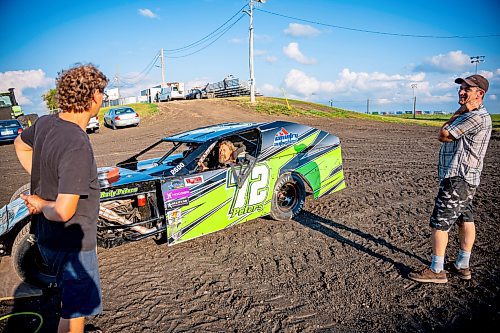 NIC ADAM / FREE PRESS
Chris Derksen, Rudy Peters, and Richard Handrie work on their car at Thursday night thunder at Victory Lanes Speedway. 
240822 - Thursday, August 22, 2024.

Reporter: ?